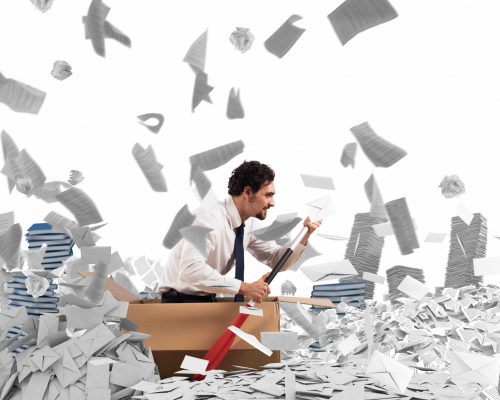Navigate the bureaucracy Concept of bureaucracy with man paddling in a sea of sheets