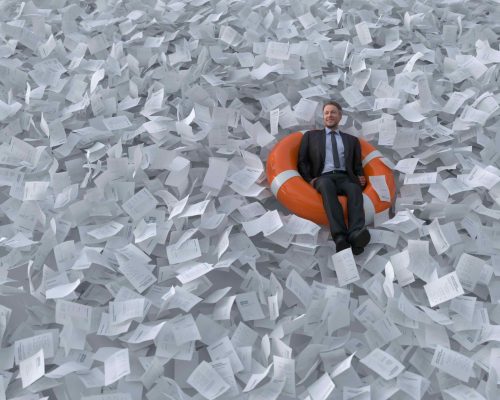 businessman are floating on the sea of paper businessman are floating on the sea of paper